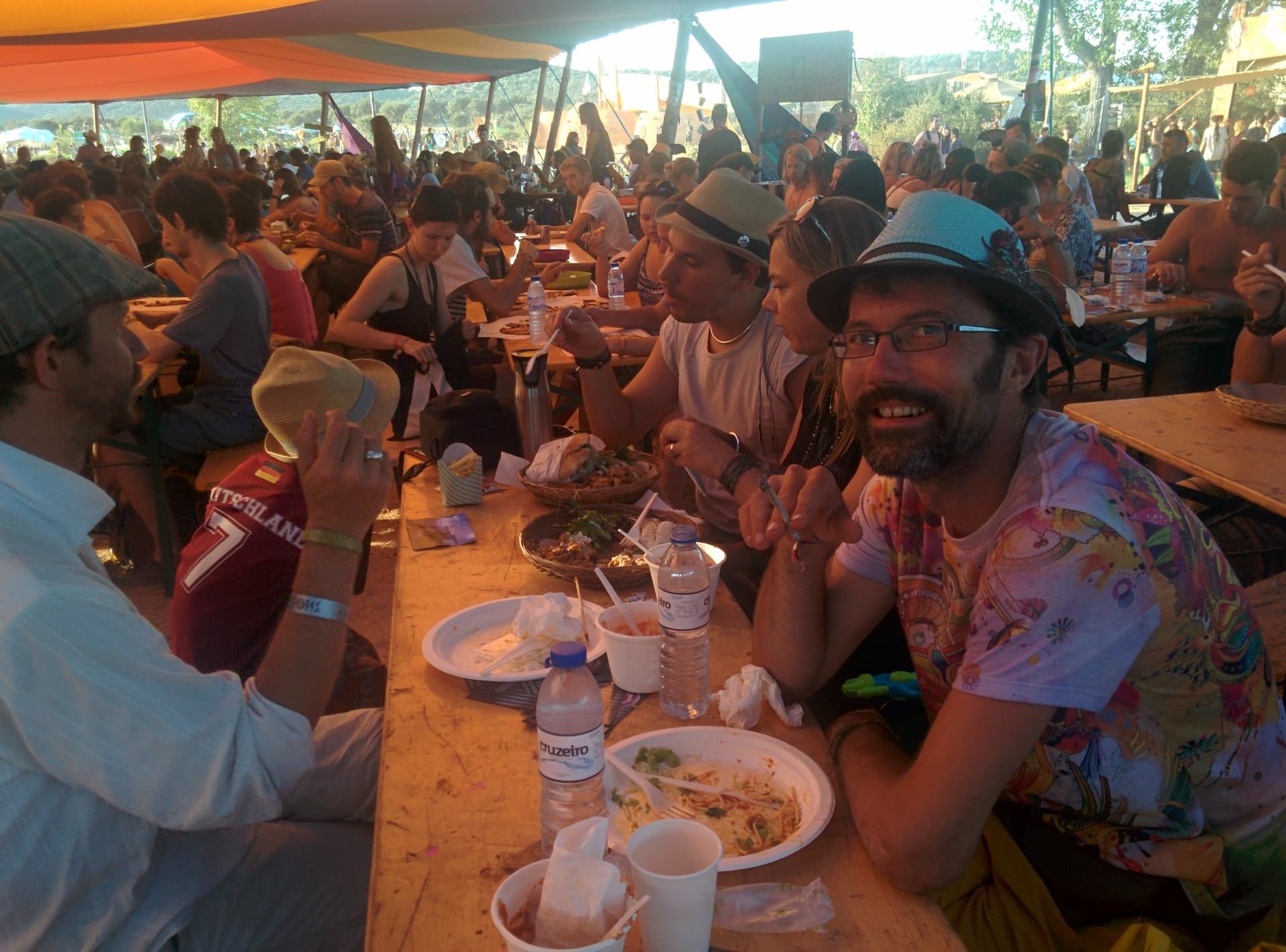 Communal meal at long tables, Boom 2014