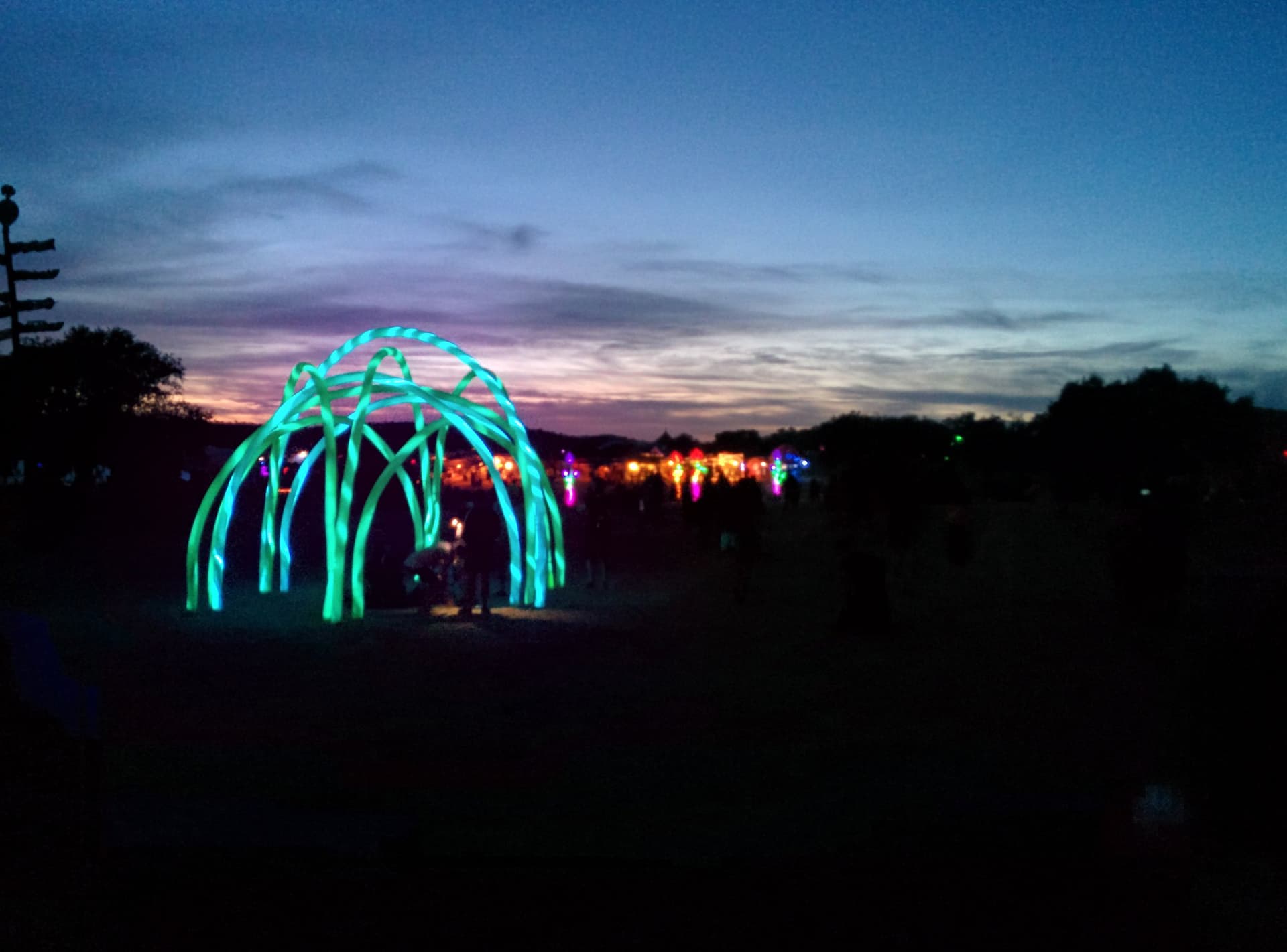 Glowing arched sculpture against the evening sky, Boom 2014