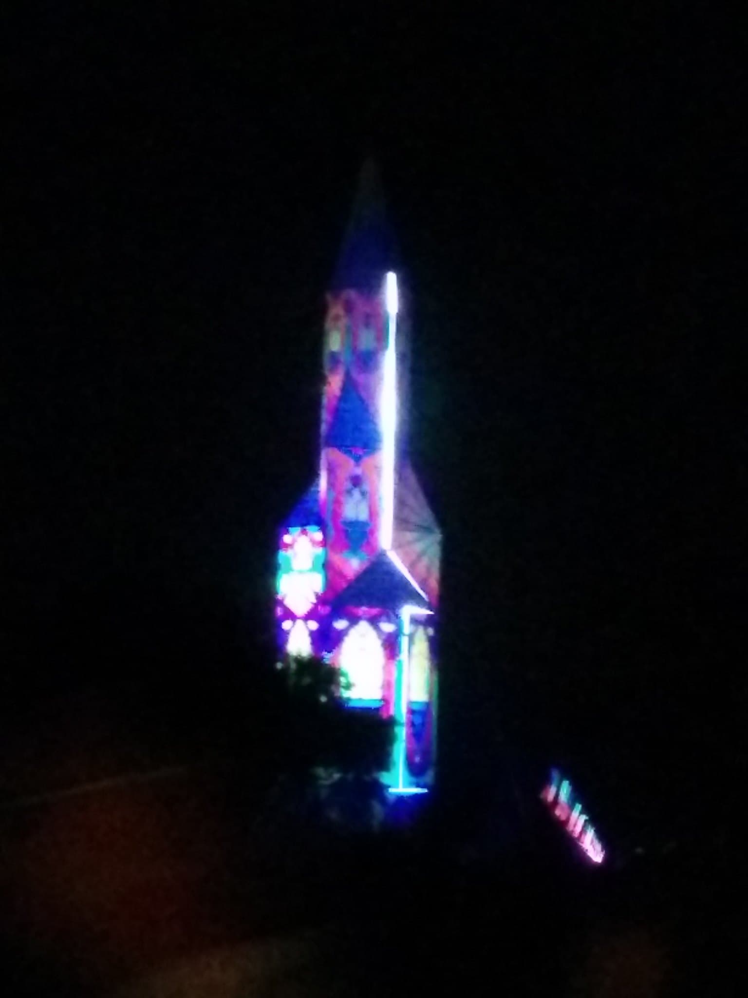 Illuminated rocket sculpture at night, Boom 2014
