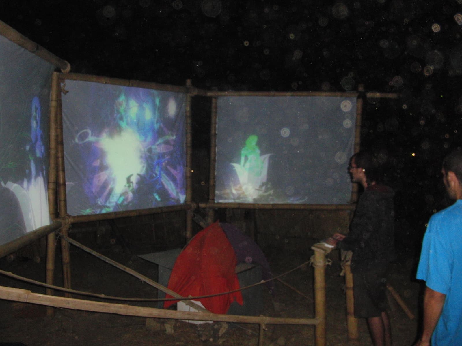 Projection panels glowing over a tent, Boom 2010
