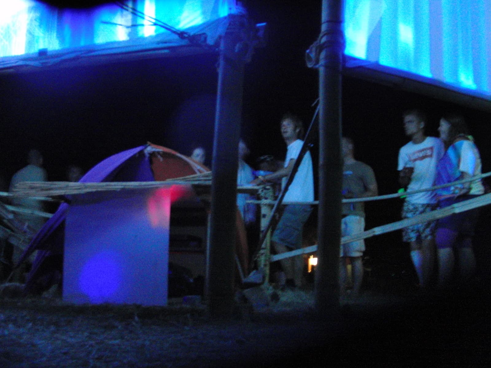 Blue lit installation with visitors at night, Boom 2010