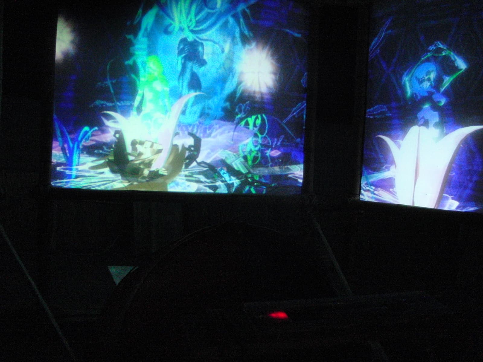 Bright projections across three dark panels, Boom 2010