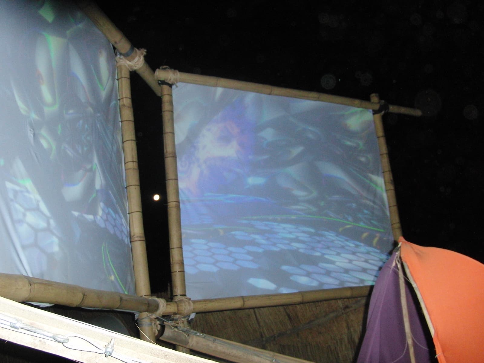 Projection panel above a tent at night, Boom 2010