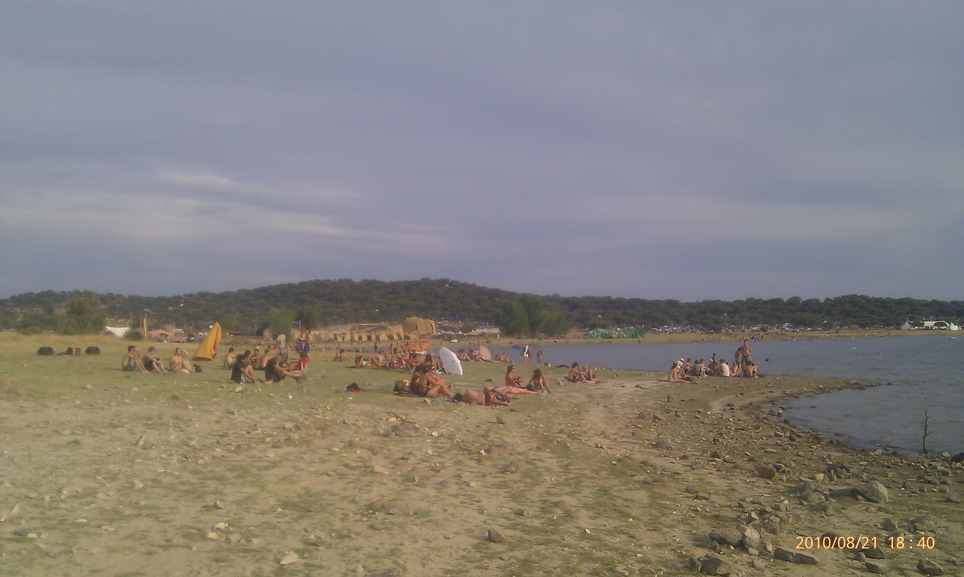 Wide view of the reservoir shore and camp, Boom 2010