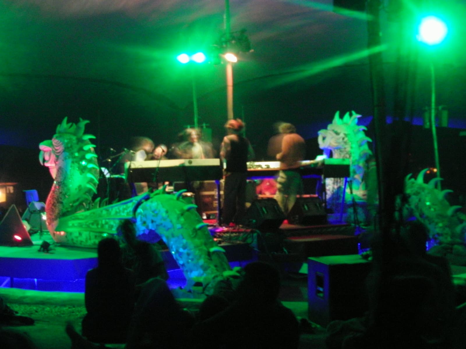 Live act on a stage flanked by dragon sculptures, Boom 2010