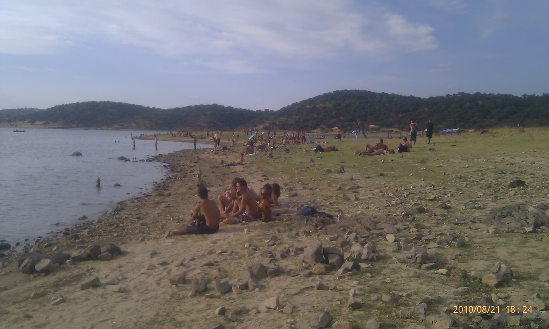 Sunbathers along the stony reservoir edge, Boom 2010