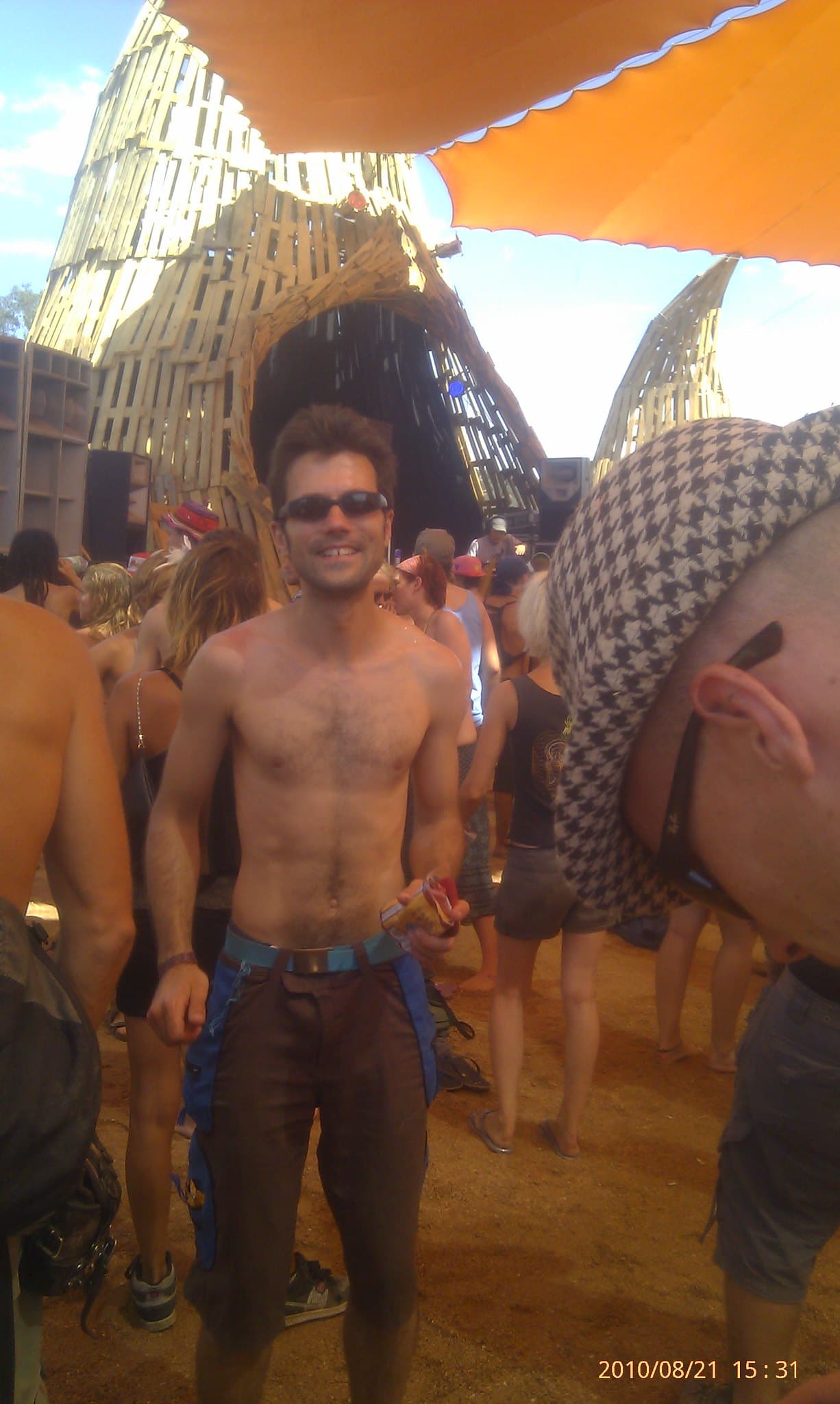Walking past the woven towers under orange shade, Boom 2010