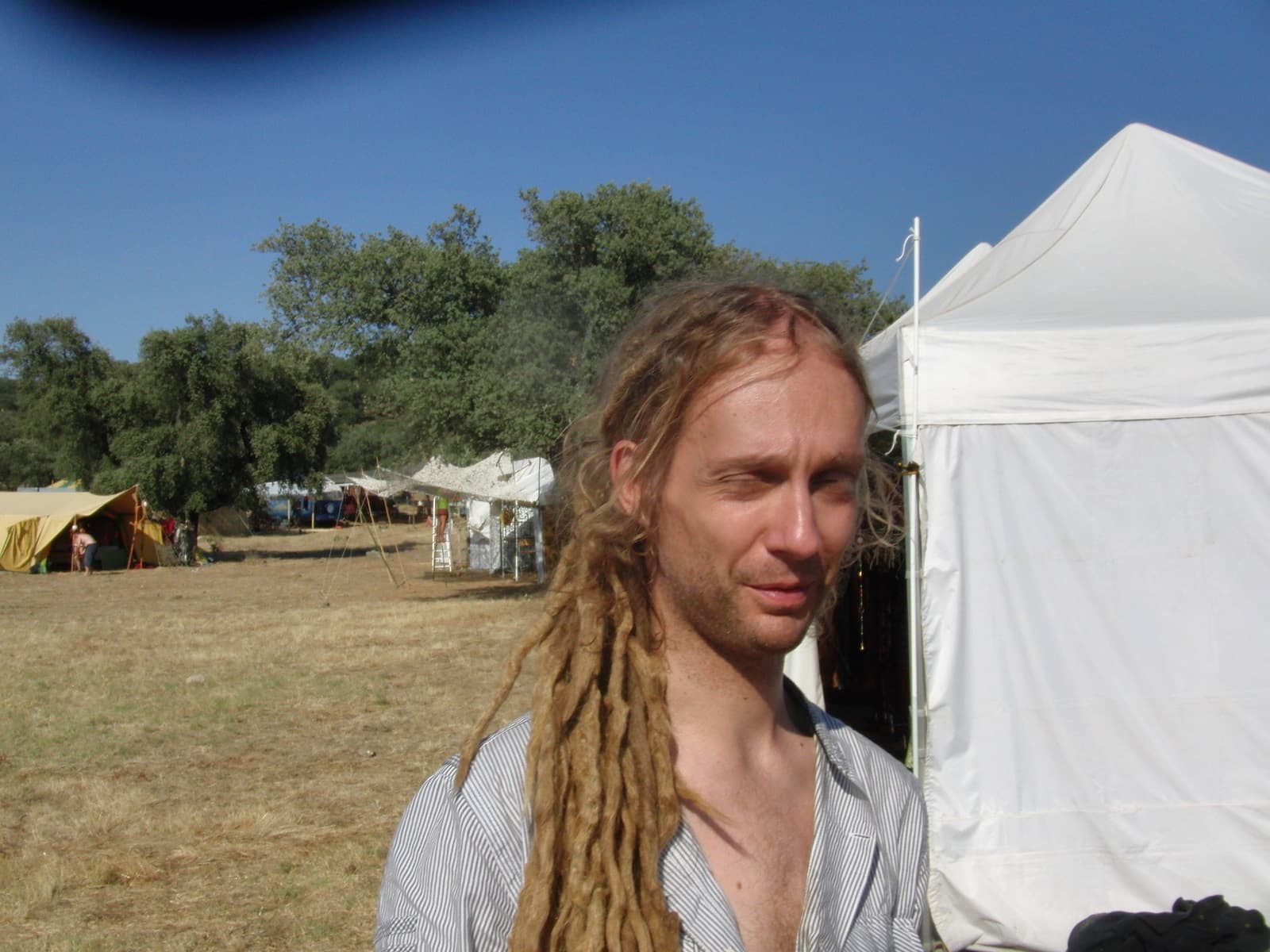 Portrait beside the tents on the campsite, Boom 2010
