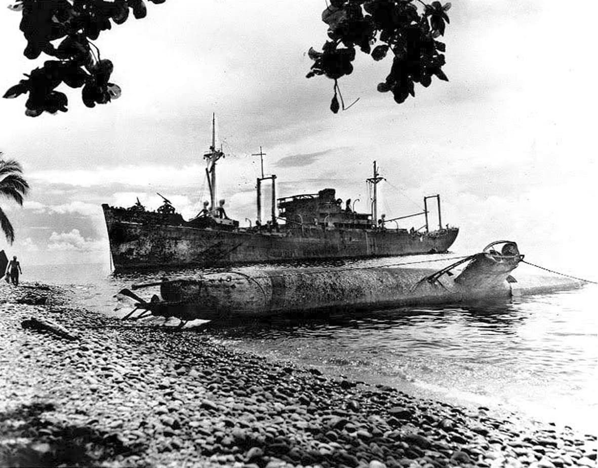 Wrecks of the Japanese transport Yamazuki Maru and a Type A class submarine on Guadalcanal, in May 1944. (NH 97250)