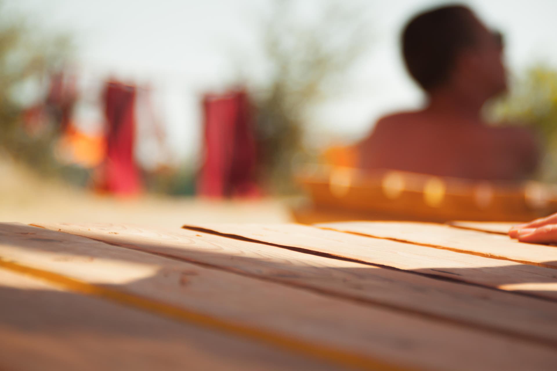 Visitor resting at a wooden table