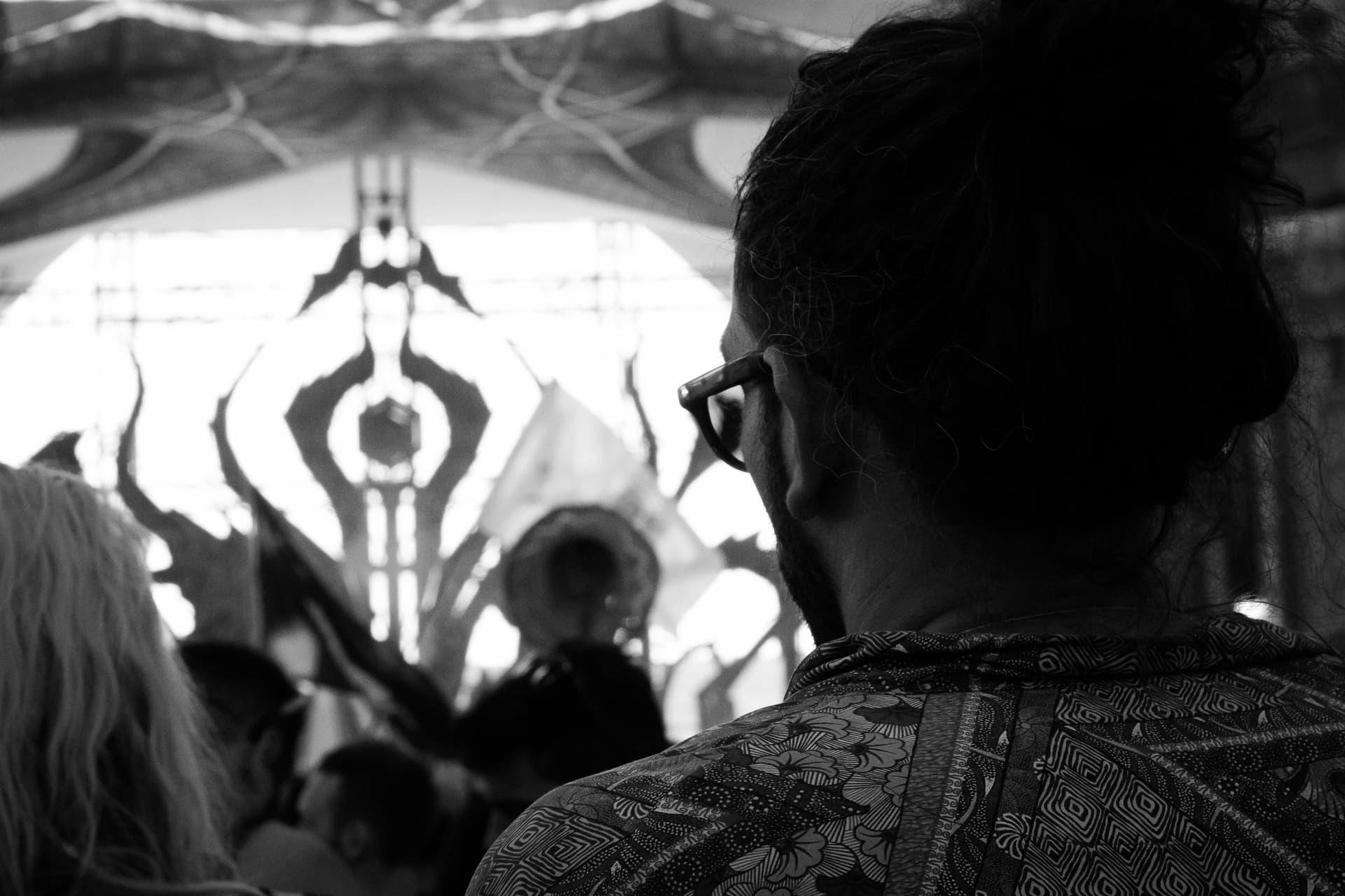 Dancer before a projected mandala backdrop