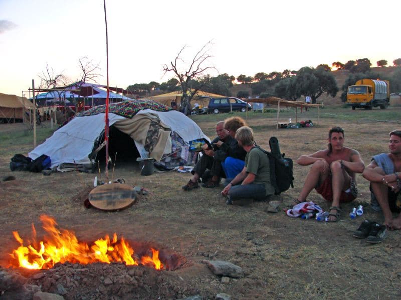 Campfire and tents on the open ground