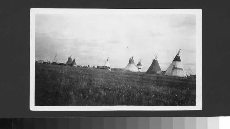 Black and white photo of many tipis by Jessie Donaldson