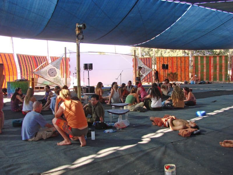 Crowd resting under an open shade structure