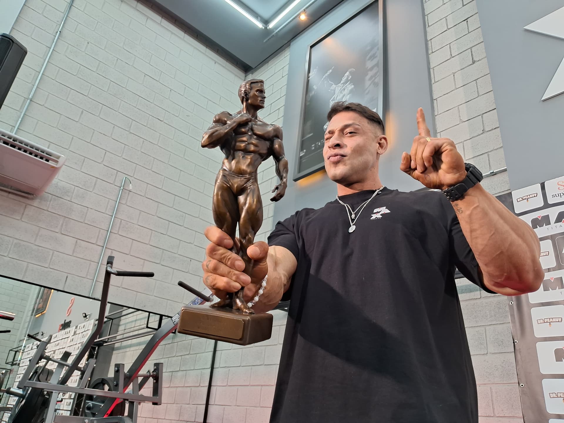 Ramon Dino with the Olympia trophy