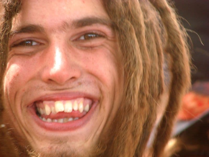 Laughing visitor with long dreadlocks
